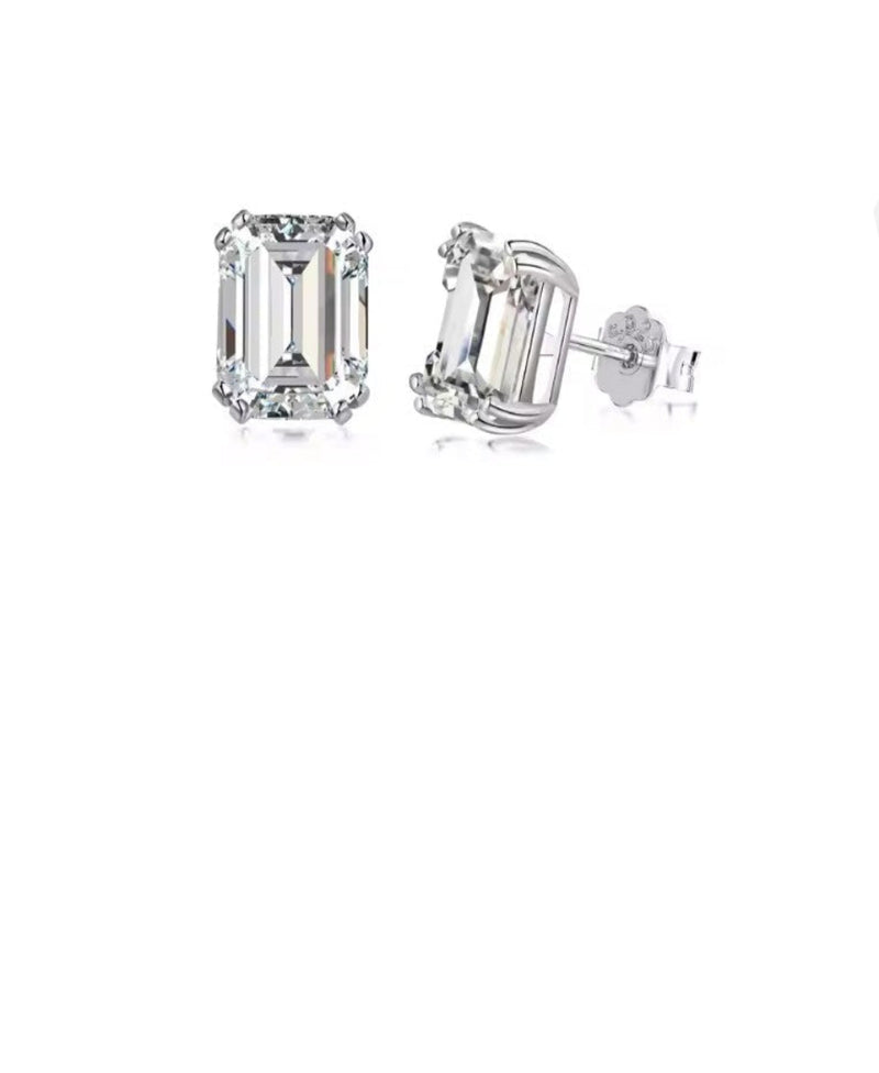 Pair of diamond stud earrings on a white background